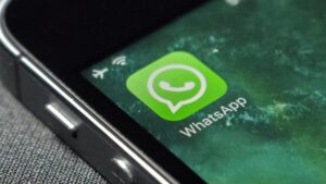 A close-up of a smartphone screen displaying the WhatsApp for Business application icon.